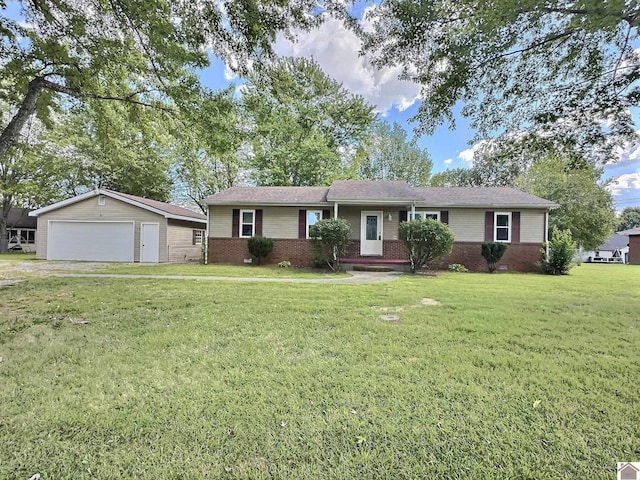 ranch-style house with a front lawn, brick siding, an outbuilding, and a garage
