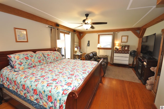 bedroom with ceiling fan and hardwood / wood-style flooring