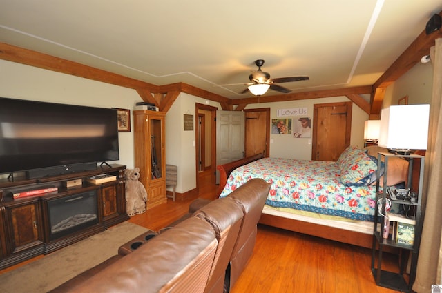 bedroom with ceiling fan and light hardwood / wood-style flooring