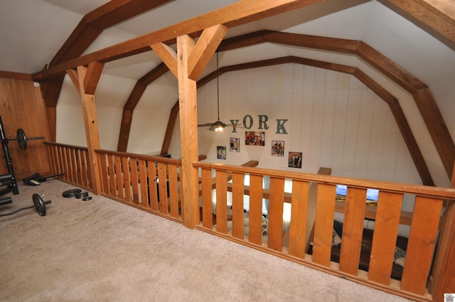 interior space featuring light carpet and vaulted ceiling