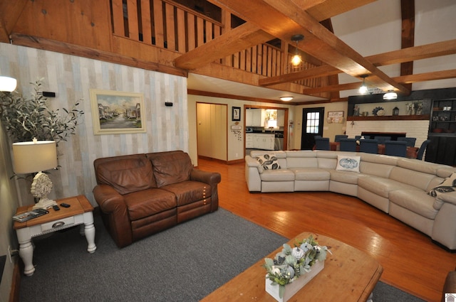 living room featuring wood-type flooring and beam ceiling