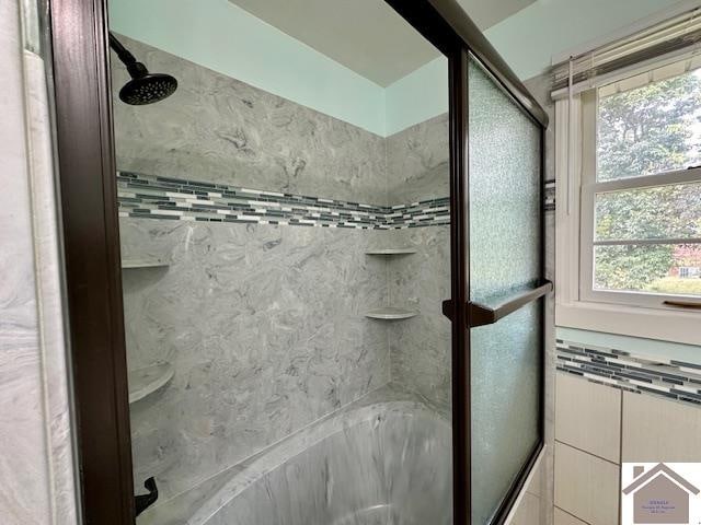 bathroom featuring plus walk in shower