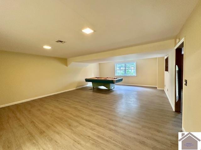 interior space with pool table and hardwood / wood-style floors