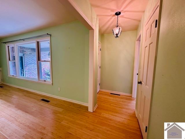 hall with light hardwood / wood-style flooring