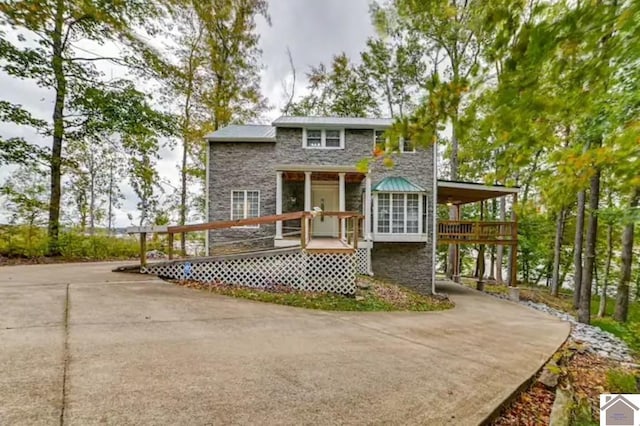 354 Sassafrass Rd, Cadiz, KY 42211 - back of house with stone siding and concrete driveway