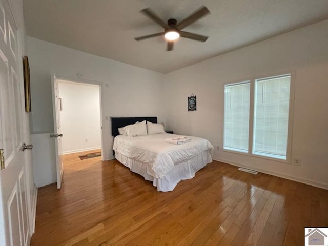 bedroom with ceiling fan and light hardwood / wood-style floors