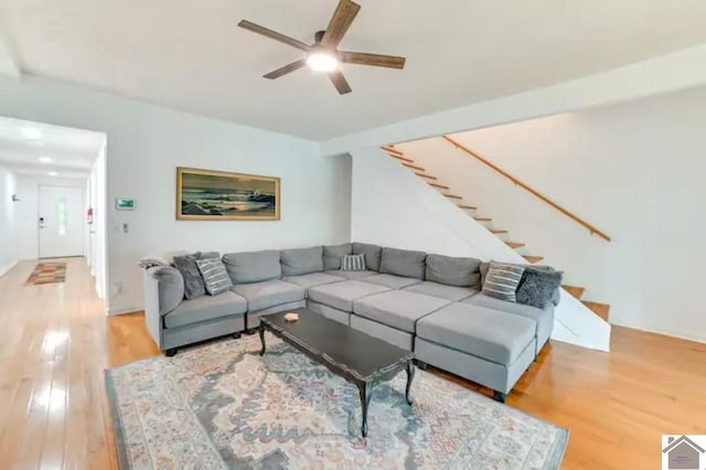 354 Sassafrass Rd, Cadiz, KY 42211 - living room featuring light wood-type flooring, ceiling fan, and stairs