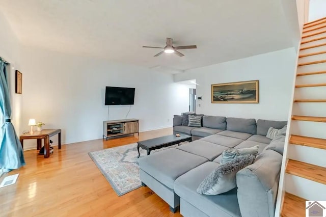 354 Sassafrass Rd, Cadiz, KY 42211 - living area featuring a ceiling fan, light wood finished floors, and stairway