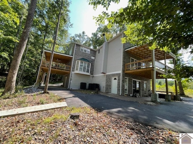 rear view of property featuring a carport