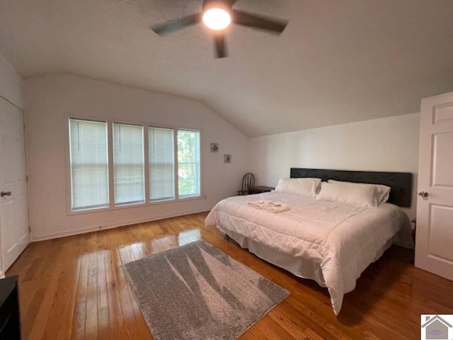 bedroom featuring lofted ceiling, ceiling fan, and hardwood / wood-style floors