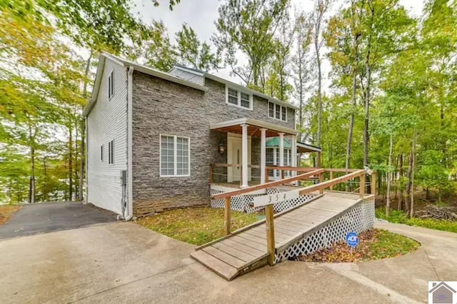 354 Sassafrass Rd, Cadiz, KY 42211 - back of property with stone siding and a deck