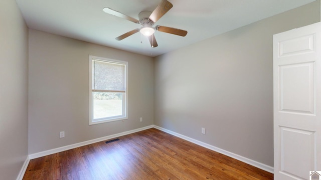 spare room featuring ceiling fan and wood-type flooring