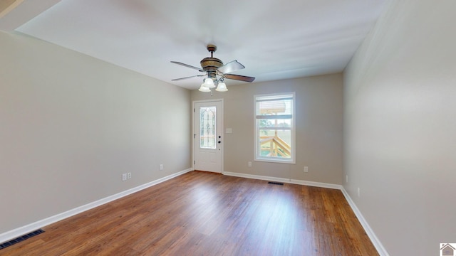 empty room featuring wood-type flooring and ceiling fan