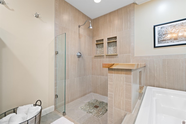 bathroom featuring independent shower and bath and tile patterned floors