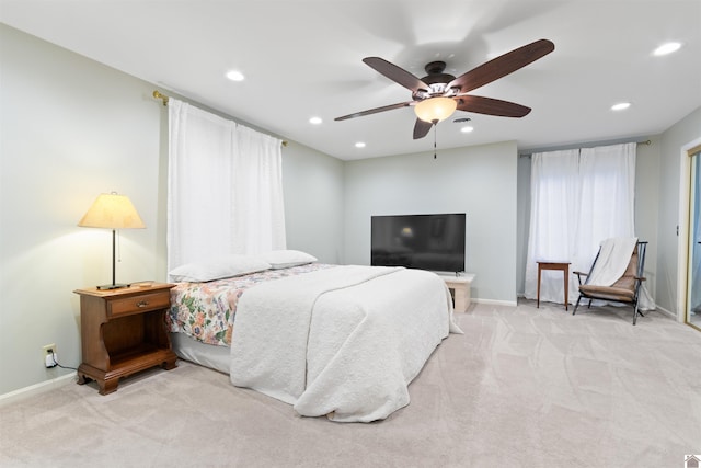 bedroom featuring ceiling fan and light colored carpet