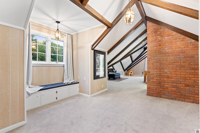 interior space with wooden walls, lofted ceiling with beams, and a chandelier