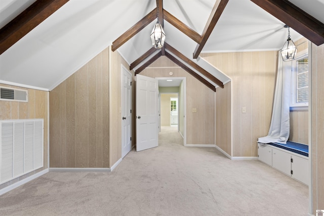 bonus room with vaulted ceiling with beams, wooden walls, a chandelier, and light colored carpet