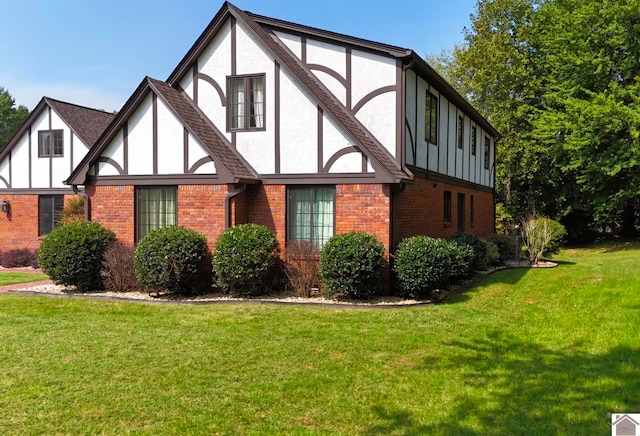 view of side of home featuring a yard