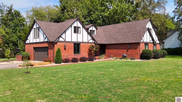 tudor-style house with a front yard and a garage