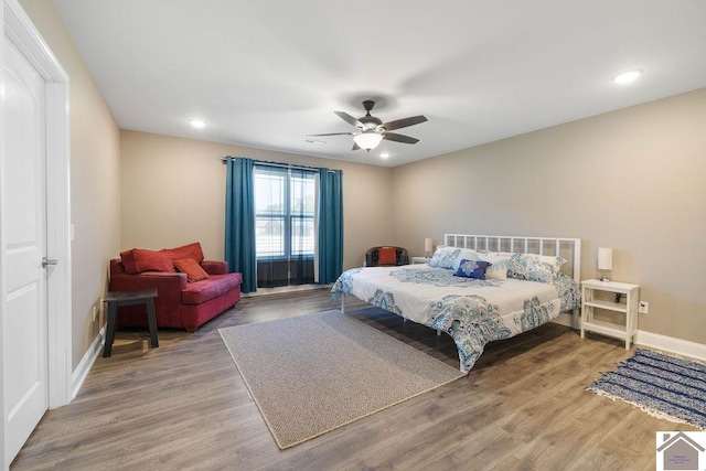 bedroom featuring ceiling fan and hardwood / wood-style flooring