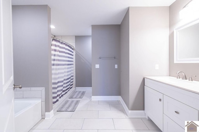 bathroom featuring plus walk in shower, tile patterned flooring, and vanity