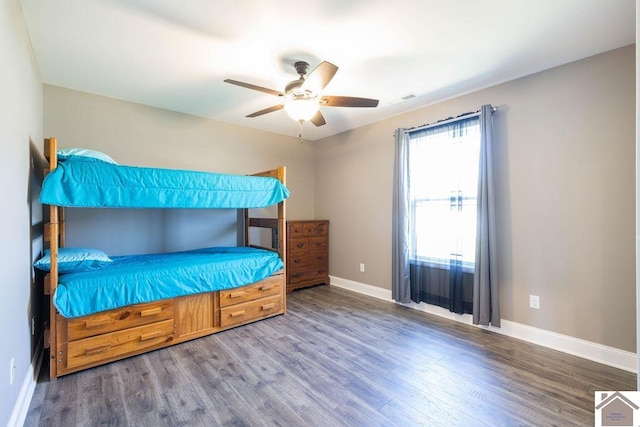 bedroom with ceiling fan and hardwood / wood-style flooring