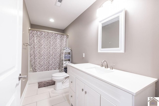 full bathroom featuring vanity, toilet, shower / bath combo with shower curtain, and tile patterned floors