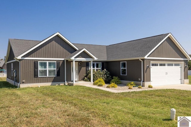 view of front of house featuring a garage and a front yard