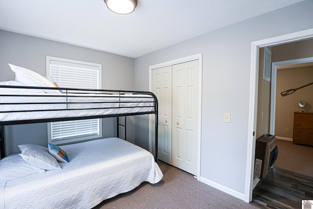 bedroom with hardwood / wood-style flooring and a closet