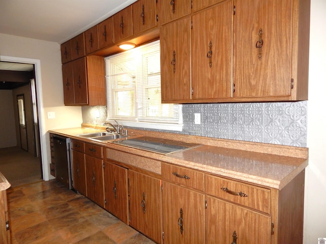 kitchen with decorative backsplash, dishwasher, stainless steel cooktop, and sink