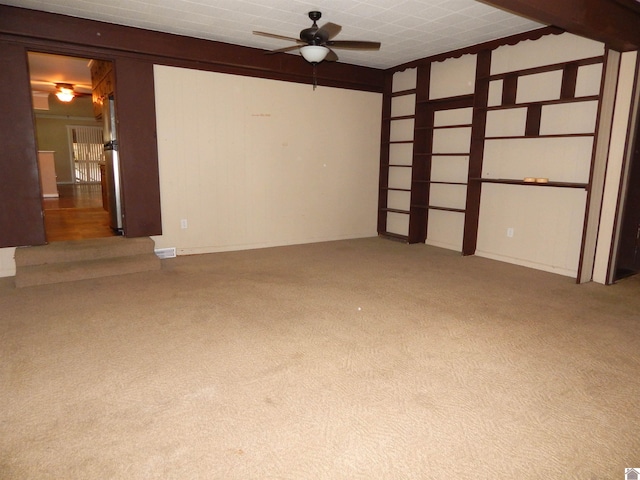 empty room with carpet and ceiling fan