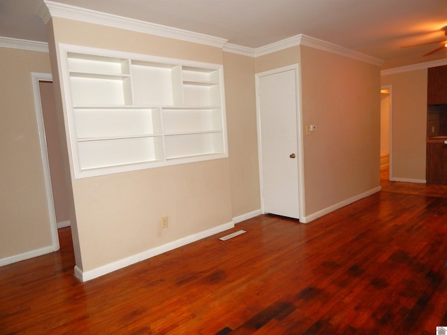 unfurnished bedroom with crown molding and dark hardwood / wood-style flooring