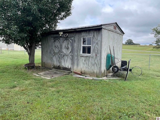 view of outdoor structure with a lawn