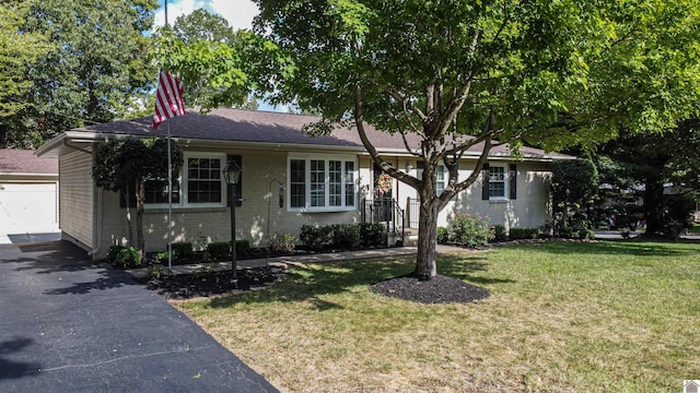 ranch-style house with a front lawn