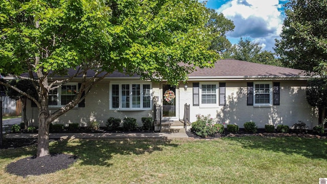 ranch-style house with a front lawn