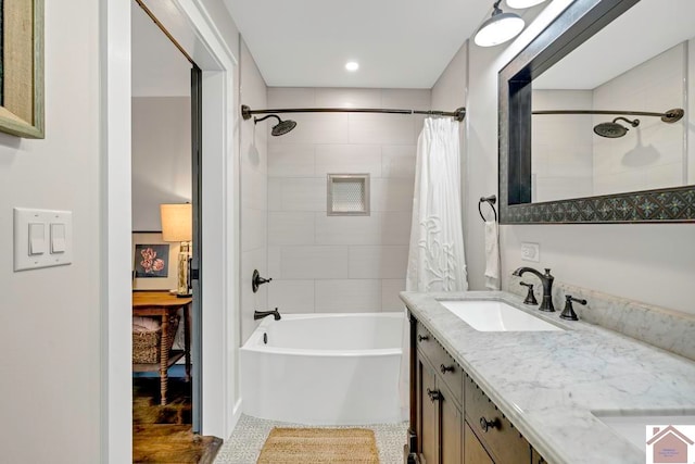 bathroom featuring shower / bath combination with curtain, vanity, and hardwood / wood-style flooring