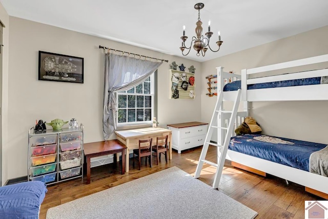 bedroom featuring a chandelier and dark hardwood / wood-style flooring