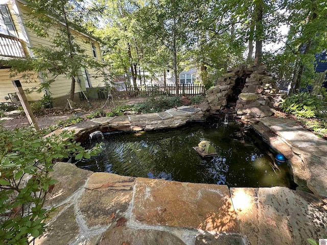 exterior space featuring a small pond