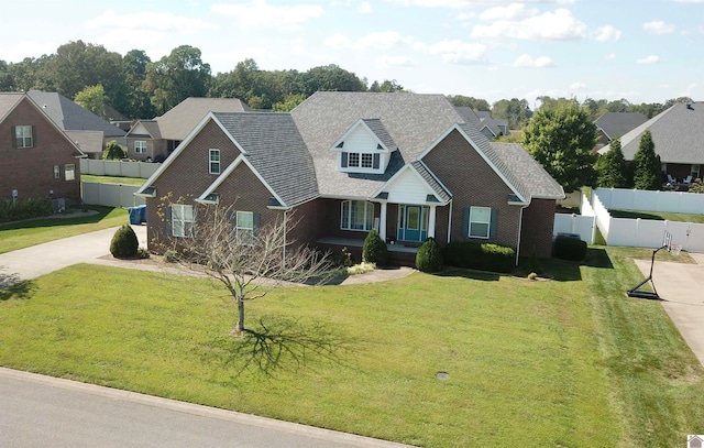 view of front of property featuring a front lawn and a garage