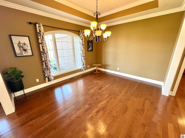 unfurnished dining area featuring wood-type flooring, a notable chandelier, and ornamental molding