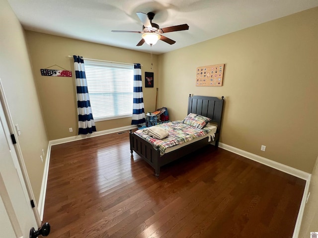 bedroom featuring ceiling fan and dark hardwood / wood-style floors