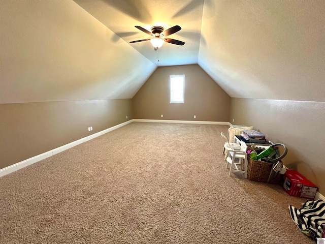 bonus room with carpet floors, lofted ceiling, and ceiling fan