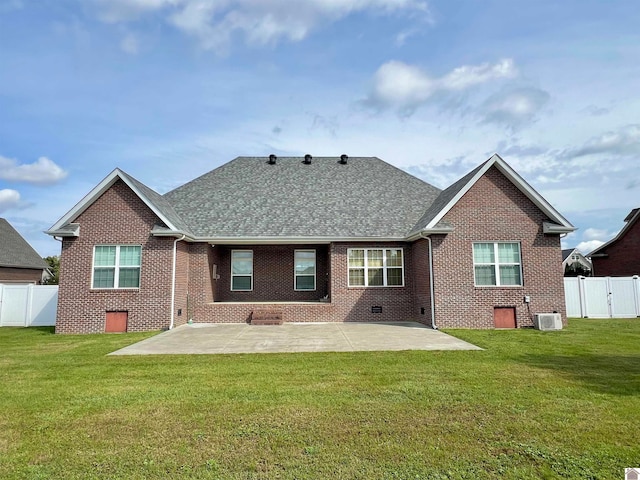 back of house featuring a patio, cooling unit, and a yard