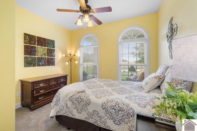 carpeted bedroom featuring ceiling fan