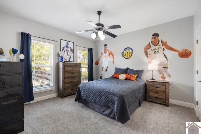 carpeted bedroom with ceiling fan