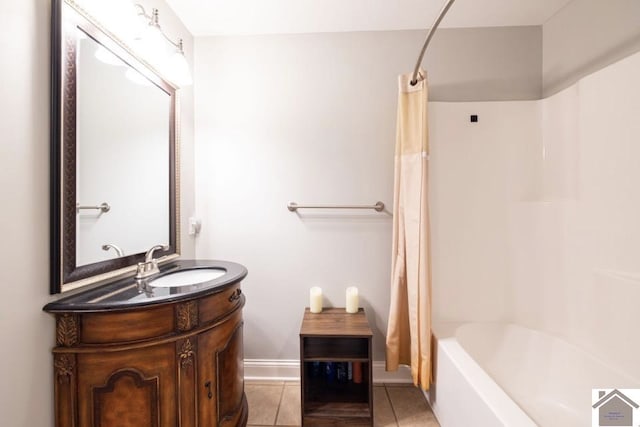 bathroom with vanity, shower / bath combo with shower curtain, and tile patterned floors