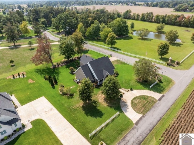 birds eye view of property with a rural view and a water view