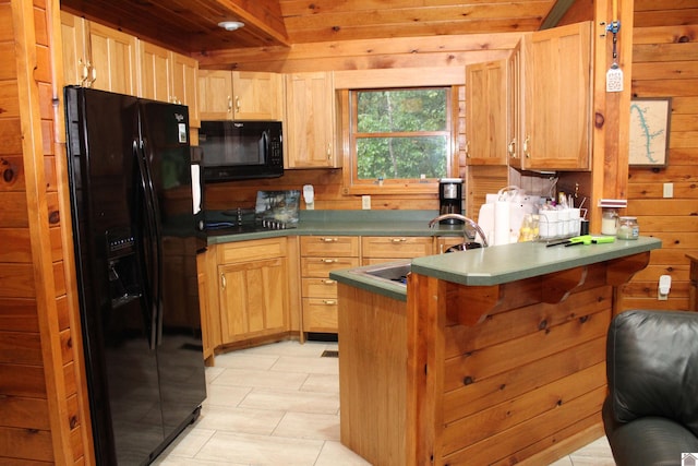 kitchen featuring wood ceiling, black appliances, light brown cabinetry, wooden walls, and sink