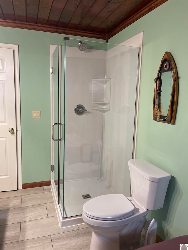 bathroom featuring wood ceiling, crown molding, walk in shower, and toilet