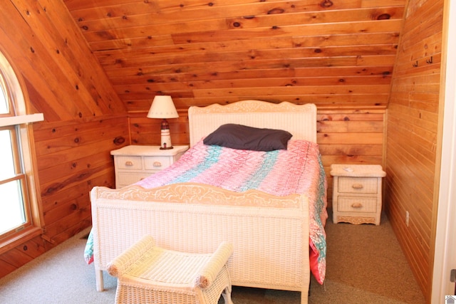 bedroom featuring wooden walls, lofted ceiling, and carpet floors